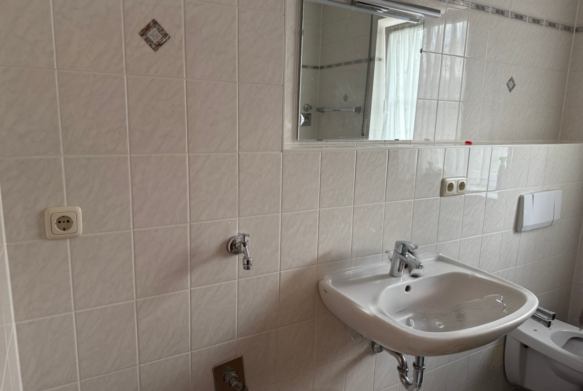 Badezimmer mit Waschmaschinenanschluss