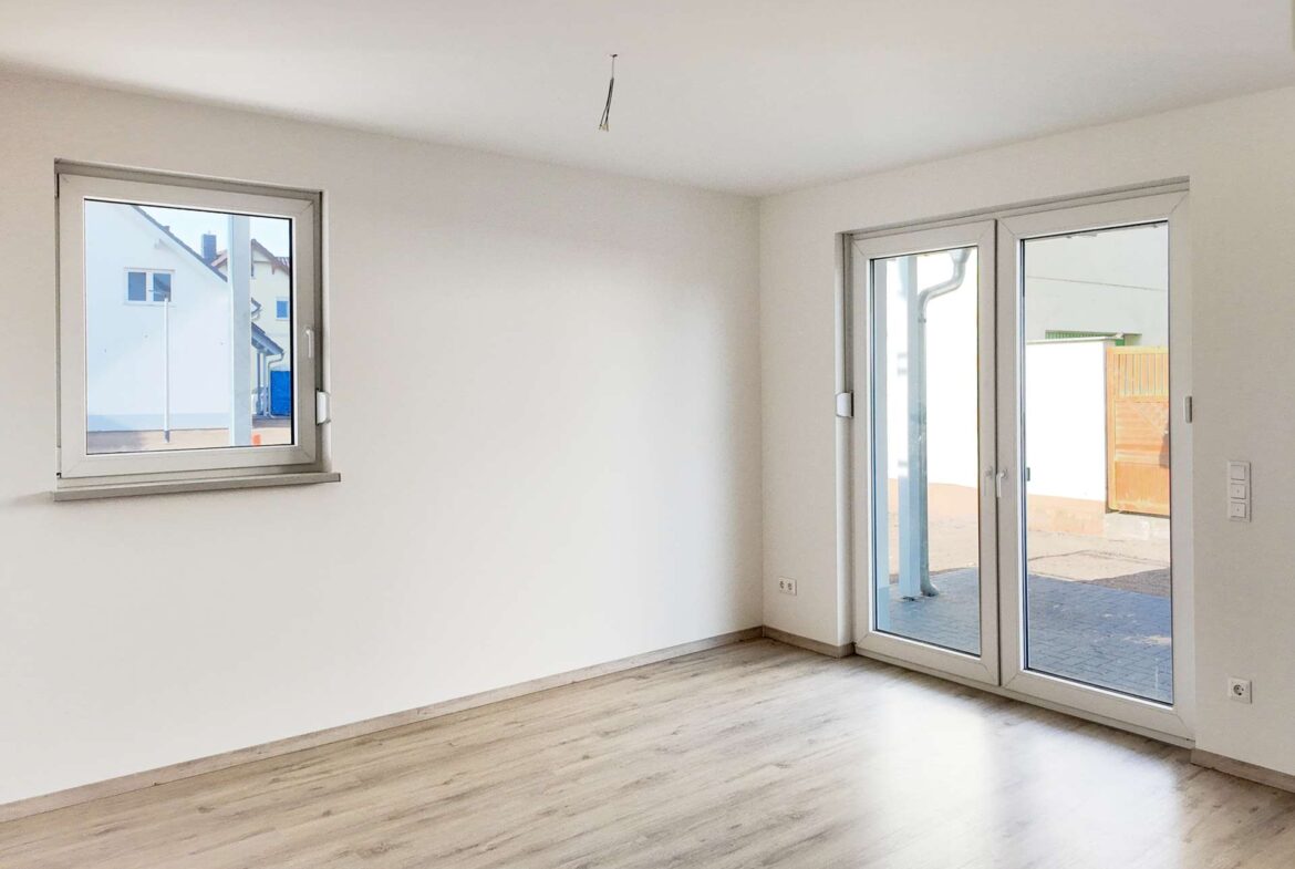 Wohnzimmer mit Terrassenzugang - Musterhaus