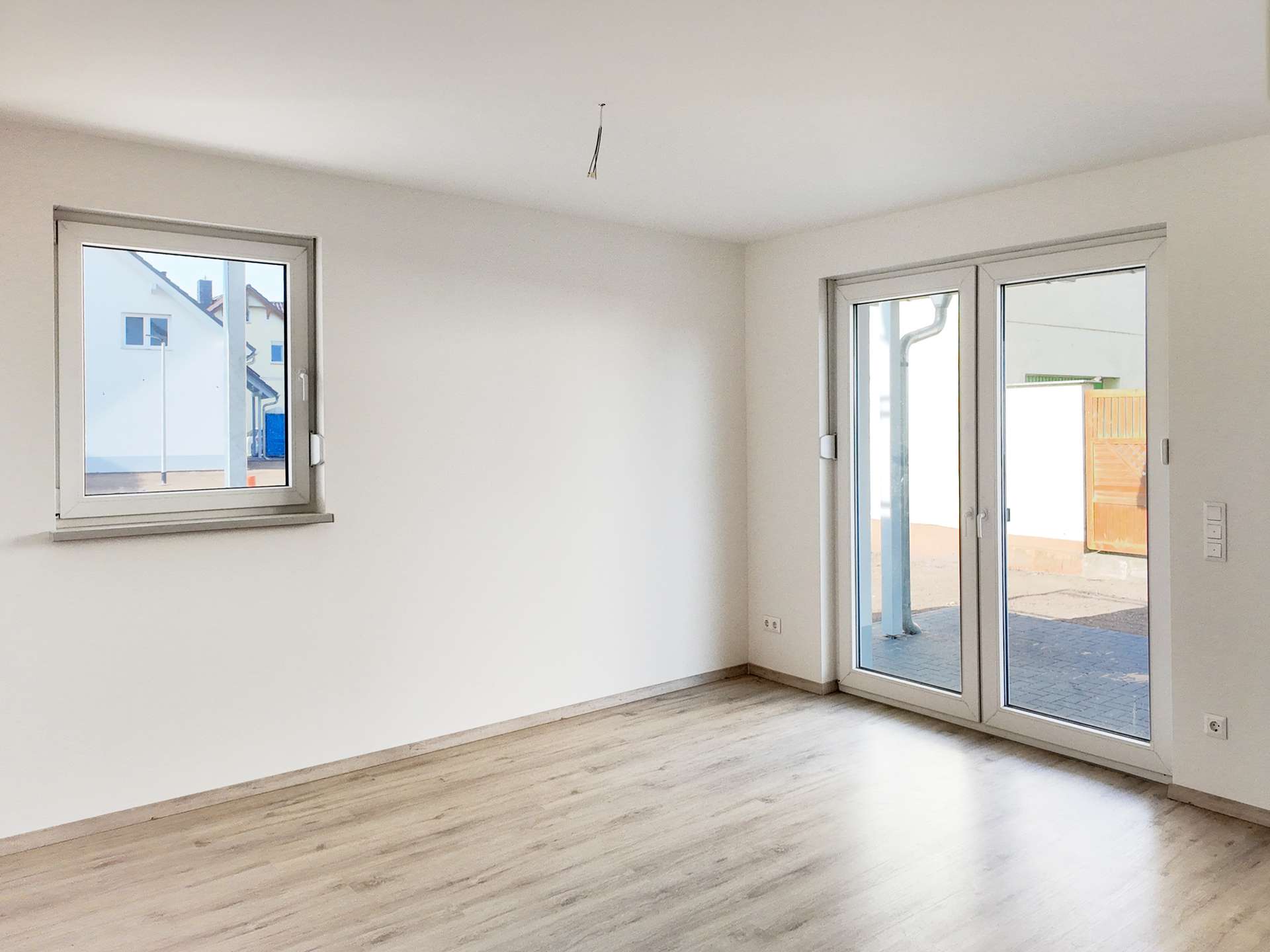 Wohnzimmer mit Terrassenzugang - Musterhaus