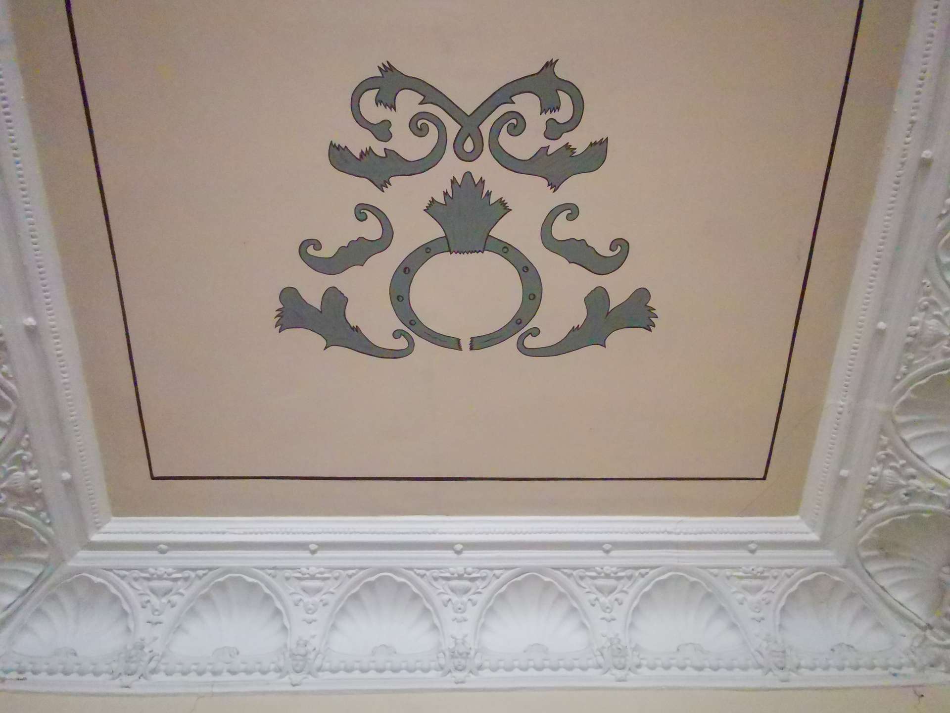 Ceiling with teal decorative motif at center, framed by a beige panel and a thin black border.