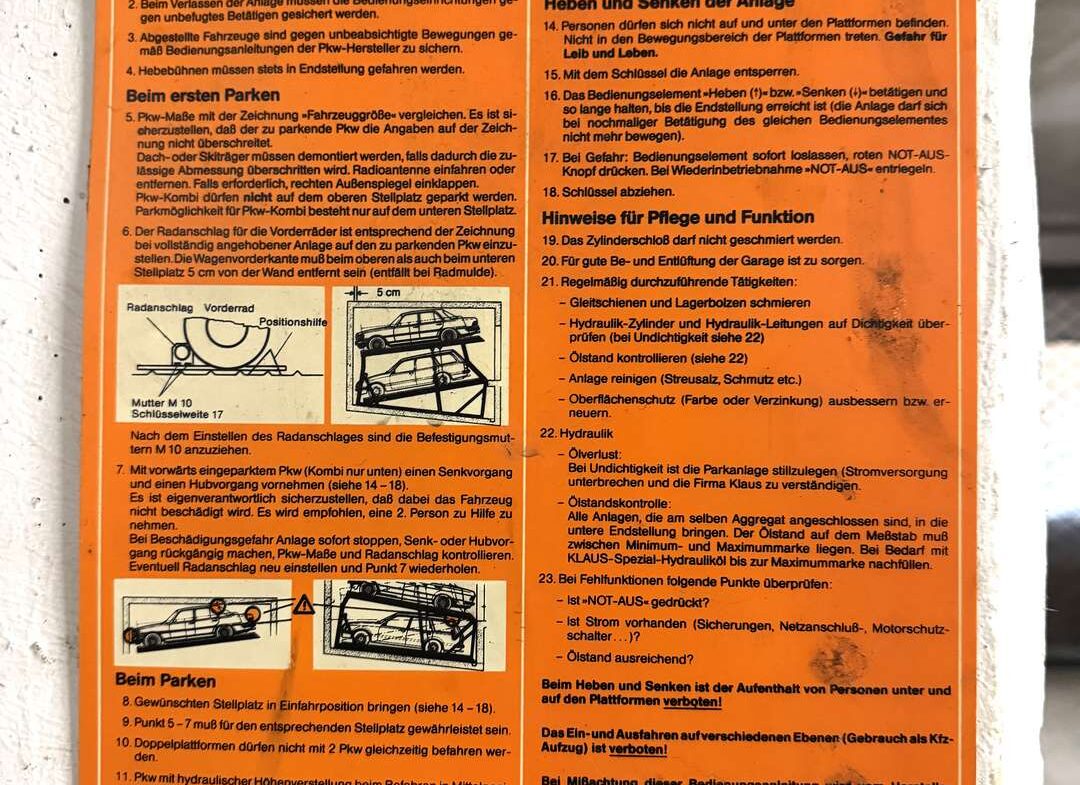 Orange Klauss Auto-Parksysteme instruction sheet with German operating rules and diagrams for installation.