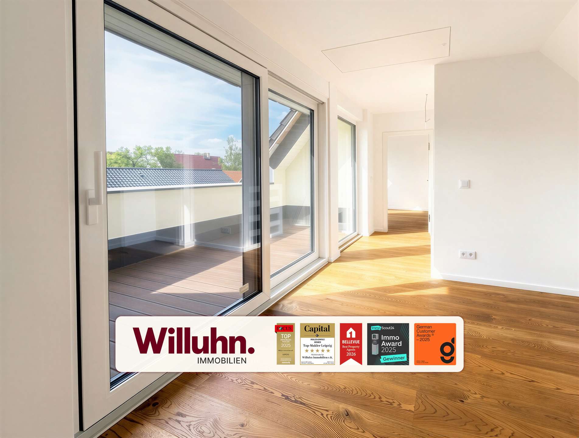 Bright modern living space with large sliding glass doors to a balcony, light hardwood floors, white walls, and ample natural light (Willuhn Immobilien branding visible).