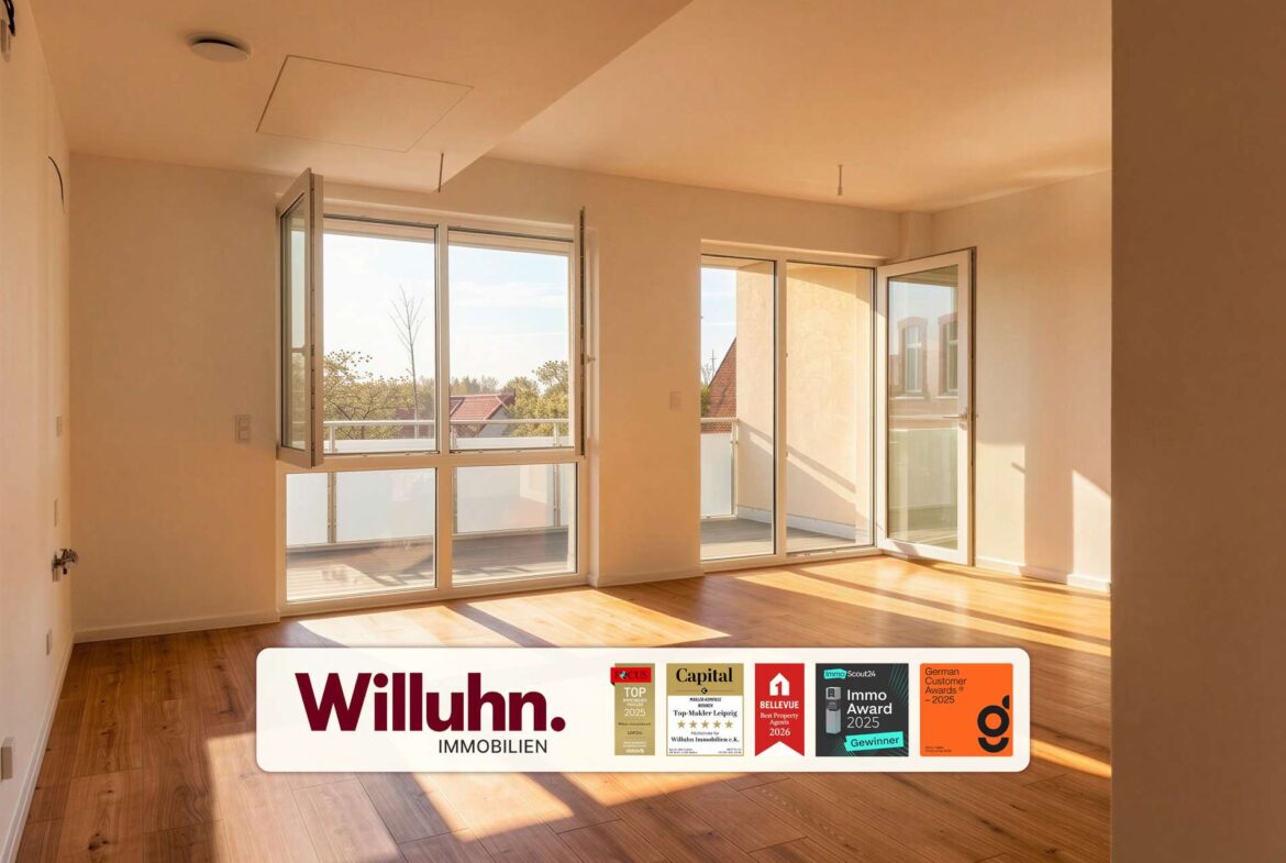 Bright empty living room with large glass doors to a balcony, sunlit wood floors, and an outdoor view.