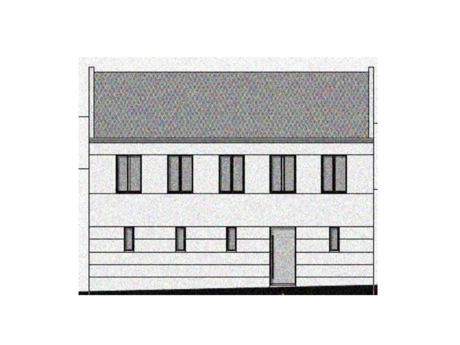 Two-story modern building facade with a flat roof and multiple narrow windows on the upper floor; entrance on the right side.