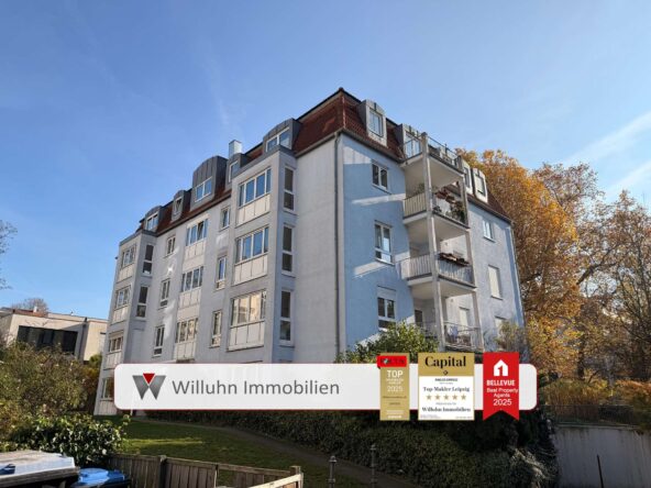 Five-story apartment building with blue and white facade under a clear sky; promotional banners for real estate agency at the bottom.