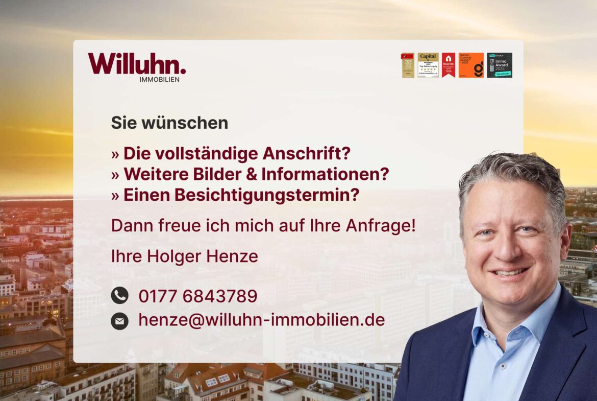 Willuhn Immobilien header ad featuring a smiling man in a blue suit on a city skyline with German text on a white overlay.