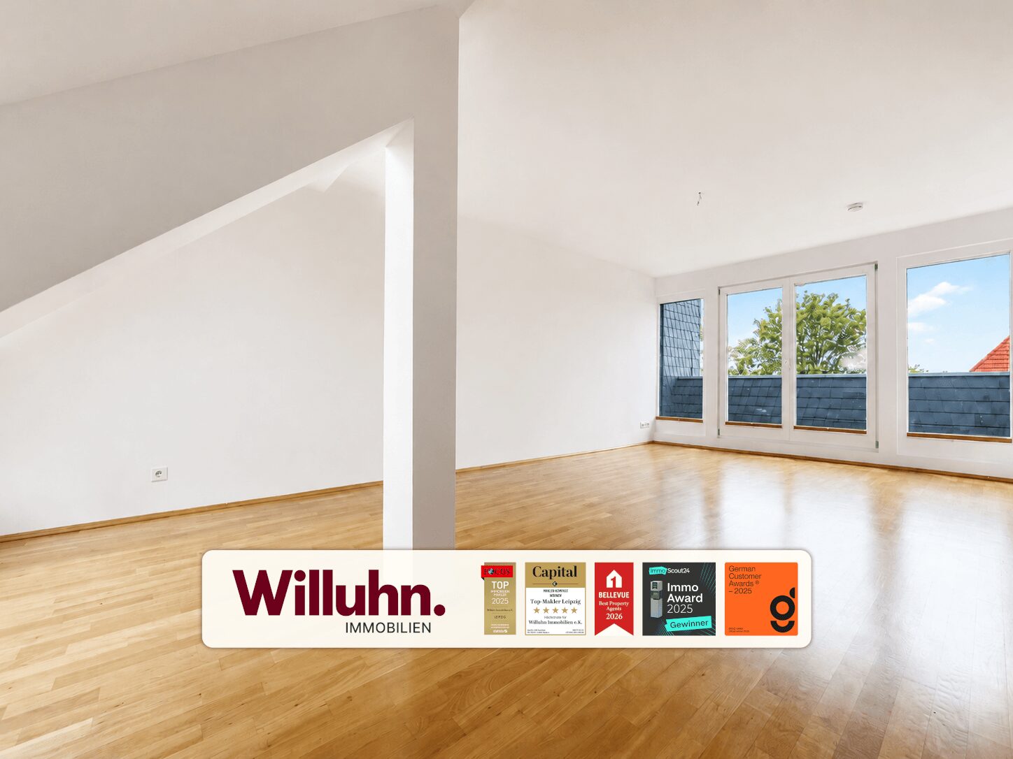 Bright empty living room with hardwood floor and large windows; white walls and a diagonal beam, branding bar along bottom.