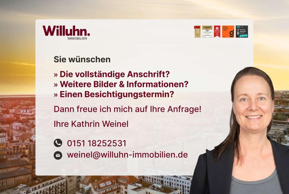 Willuhn Immobilien banner with a smiling woman on the right, city skyline at sunset, and German contact text.
