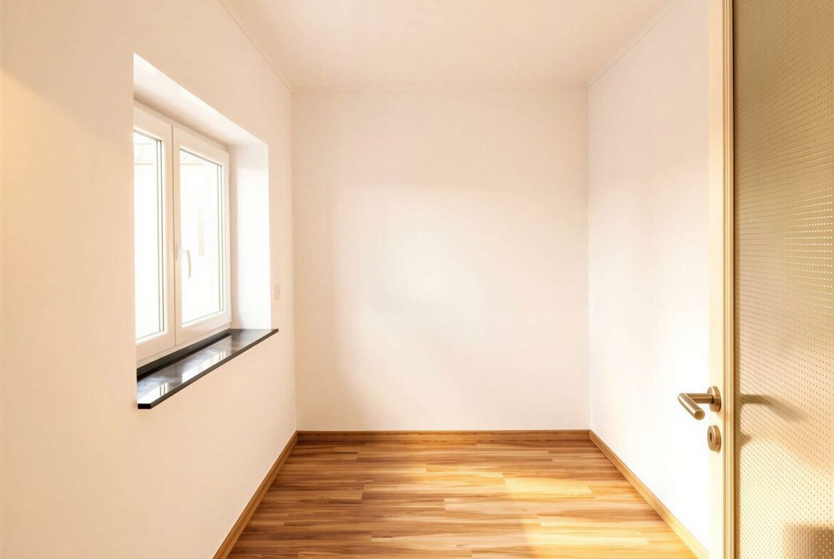 Bright empty corner of a room with a window on the left and a glass-panel door on the right, wooden floor.