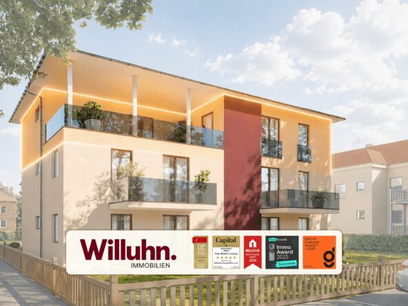 Modern apartment building with glass balconies and warm exterior lighting, displaying a Willuhn Immobilien sign and award logos in the foreground.