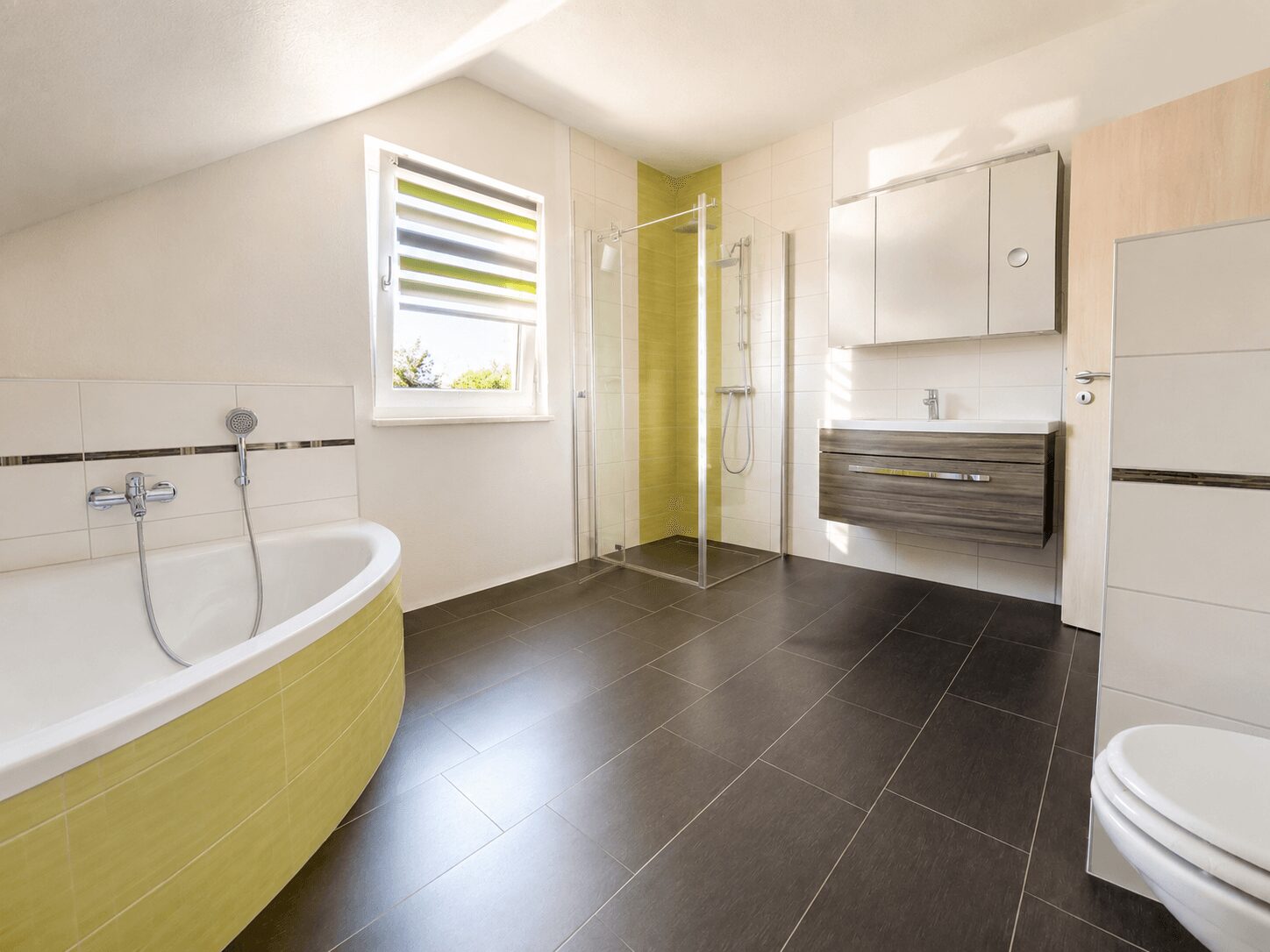 Modern bathroom with a corner bathtub, glass shower enclosure, and wall-mounted vanity with a wooden finish.