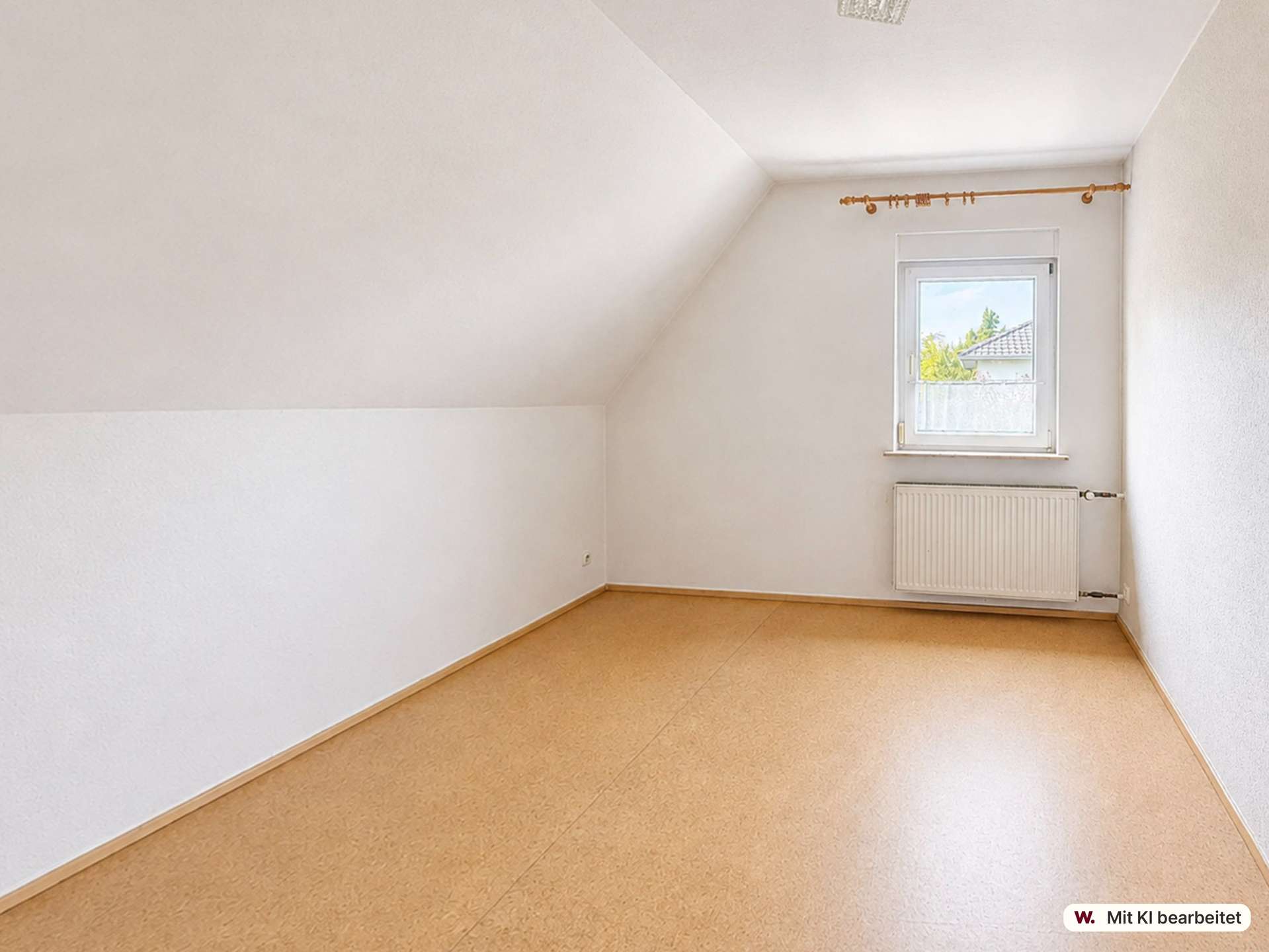 Empty white attic-like room with a sloped ceiling on the left, a small window above a radiator, and beige flooring.