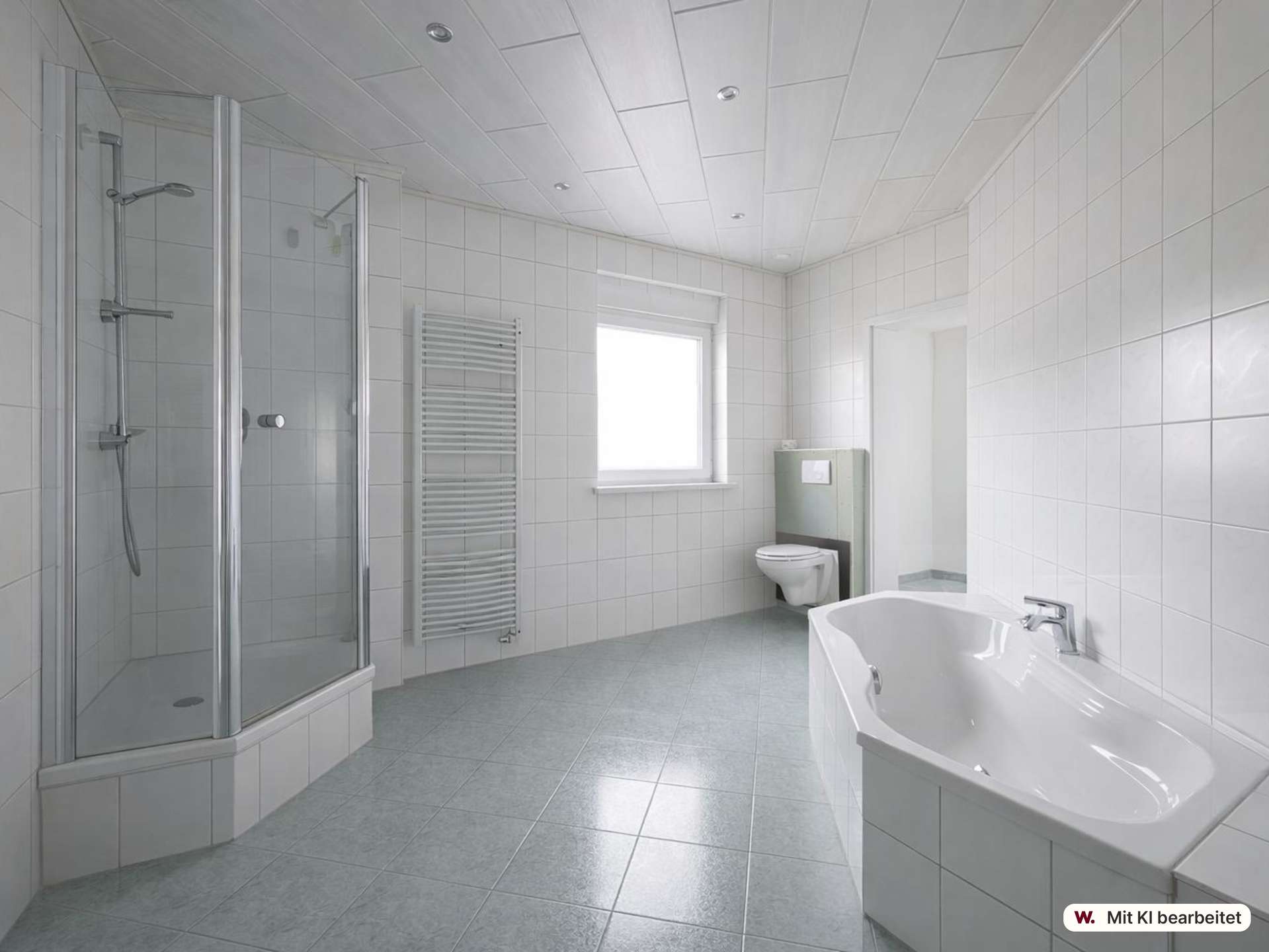 Modern white bathroom with a glass shower enclosure, toilet, and freestanding tub under a bright windowed wall.